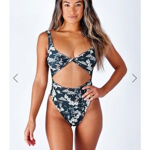 Skatie Chloe one piece in cheetah. First is to show what it looks like on.